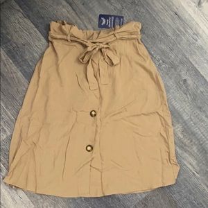Tan skirt - knee length if wearing as high waisted
